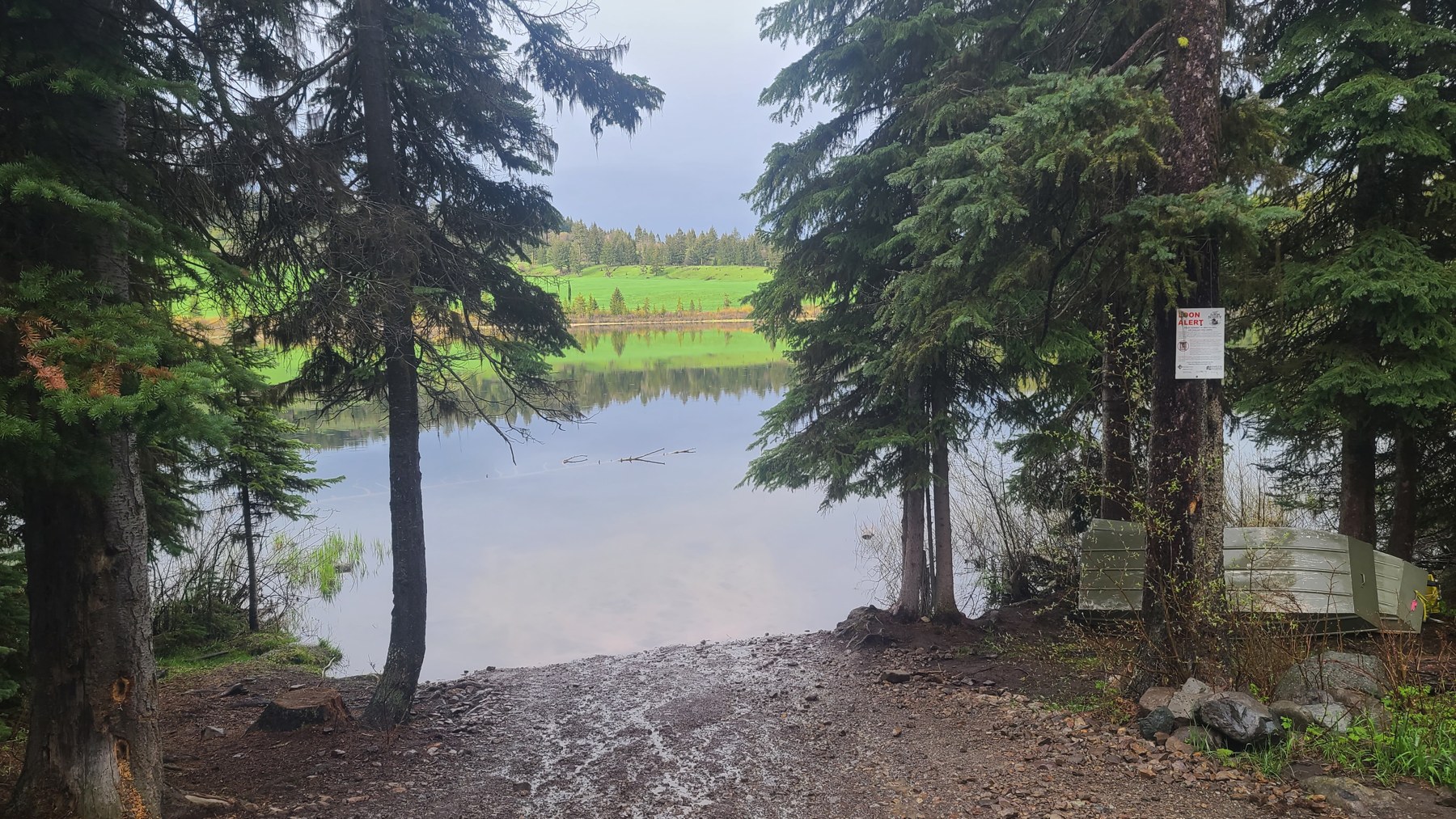 Shoreline view and camp access beside the stillwater lake