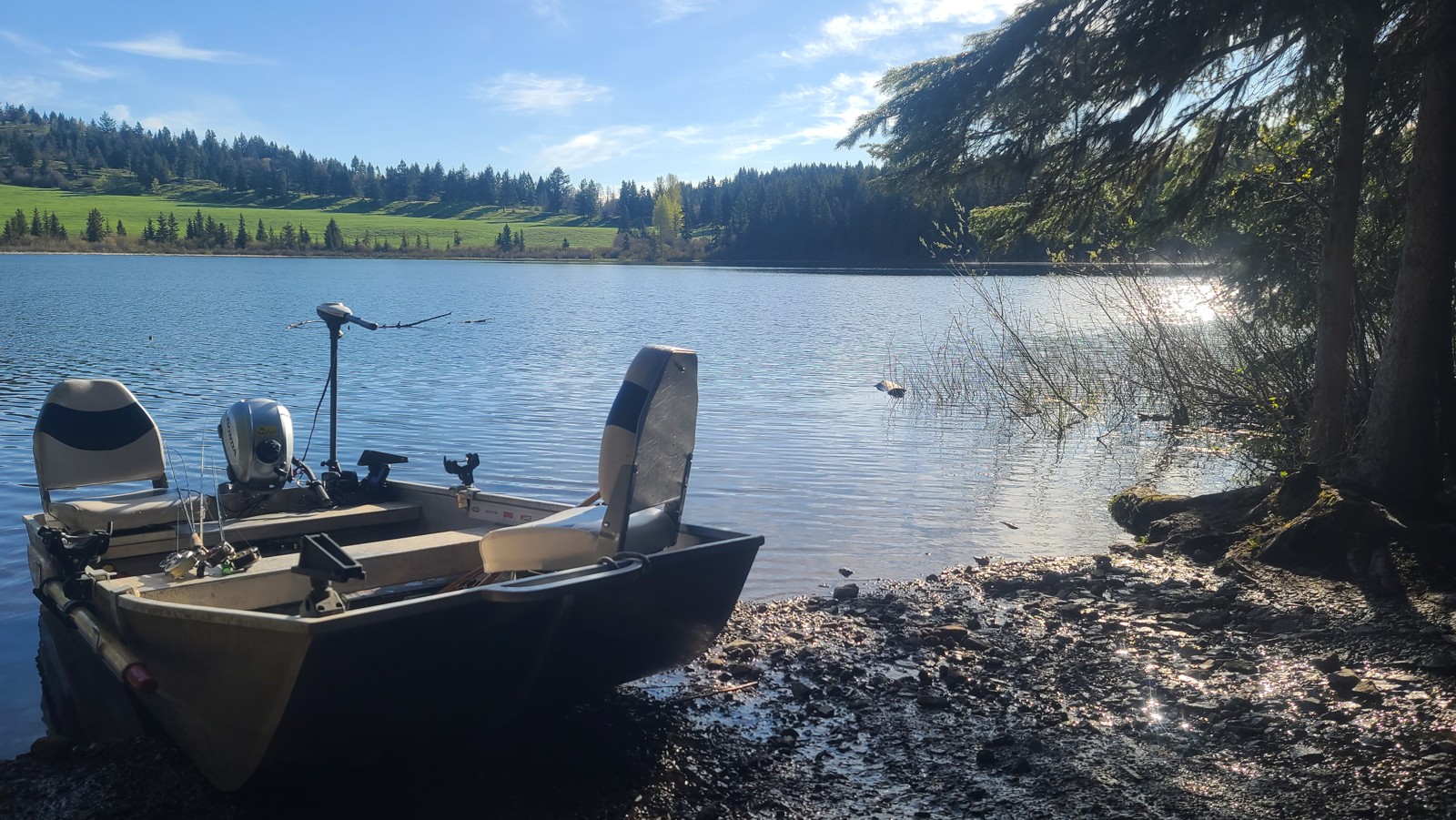 Boat pulled up at a clean shoreline launch