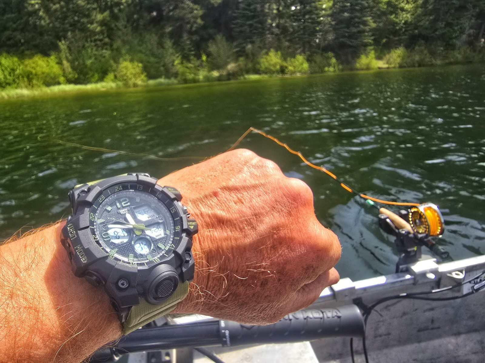 On-the-water trolling setup beside the rod and reel