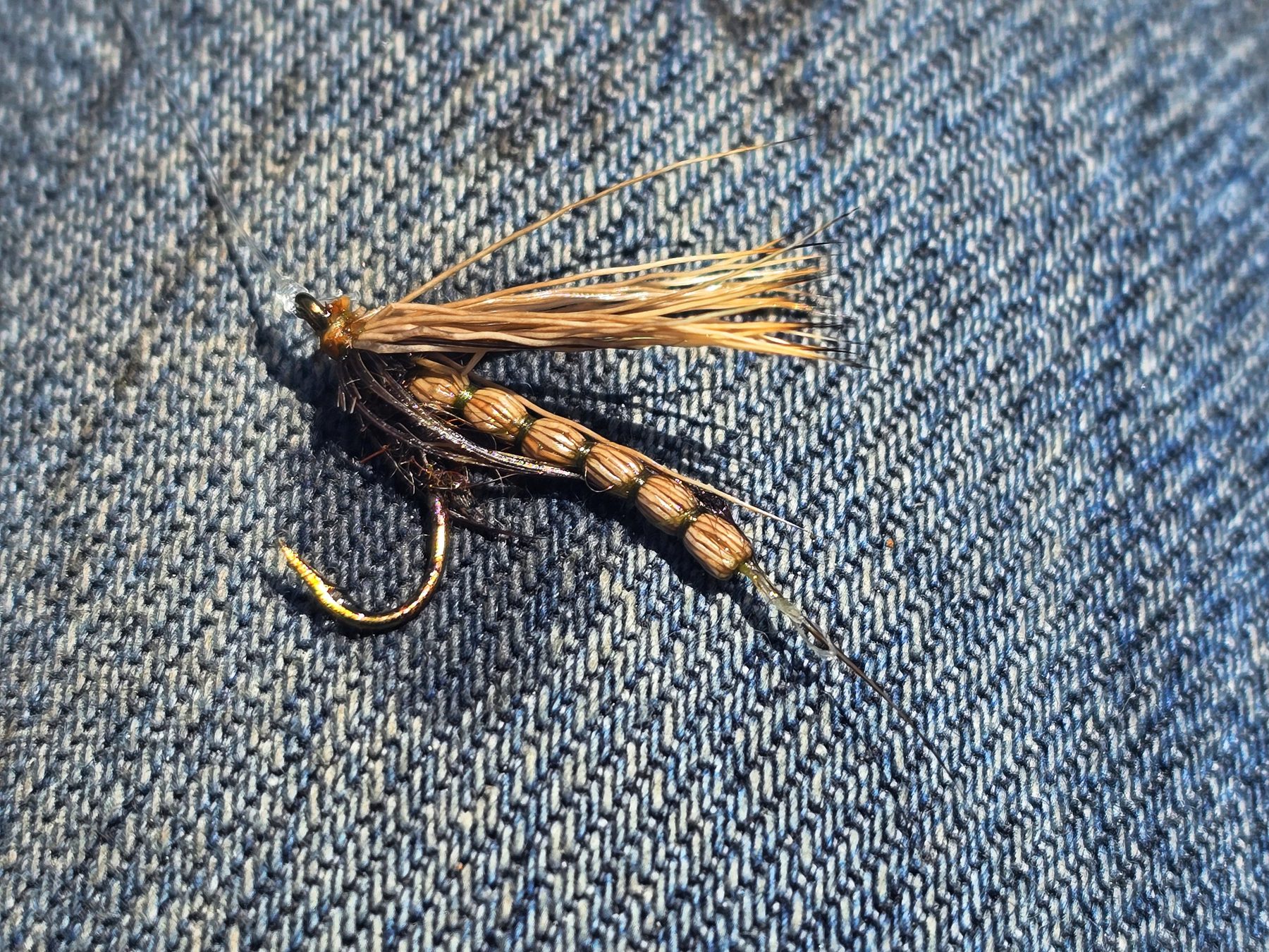 Fly pattern laid on denim
